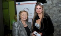 Minister Fitzgerald presents Angela McDonagh with a raffle prize of an MP3 player